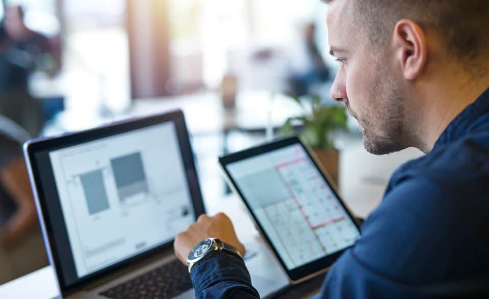 man looking at laptop screen